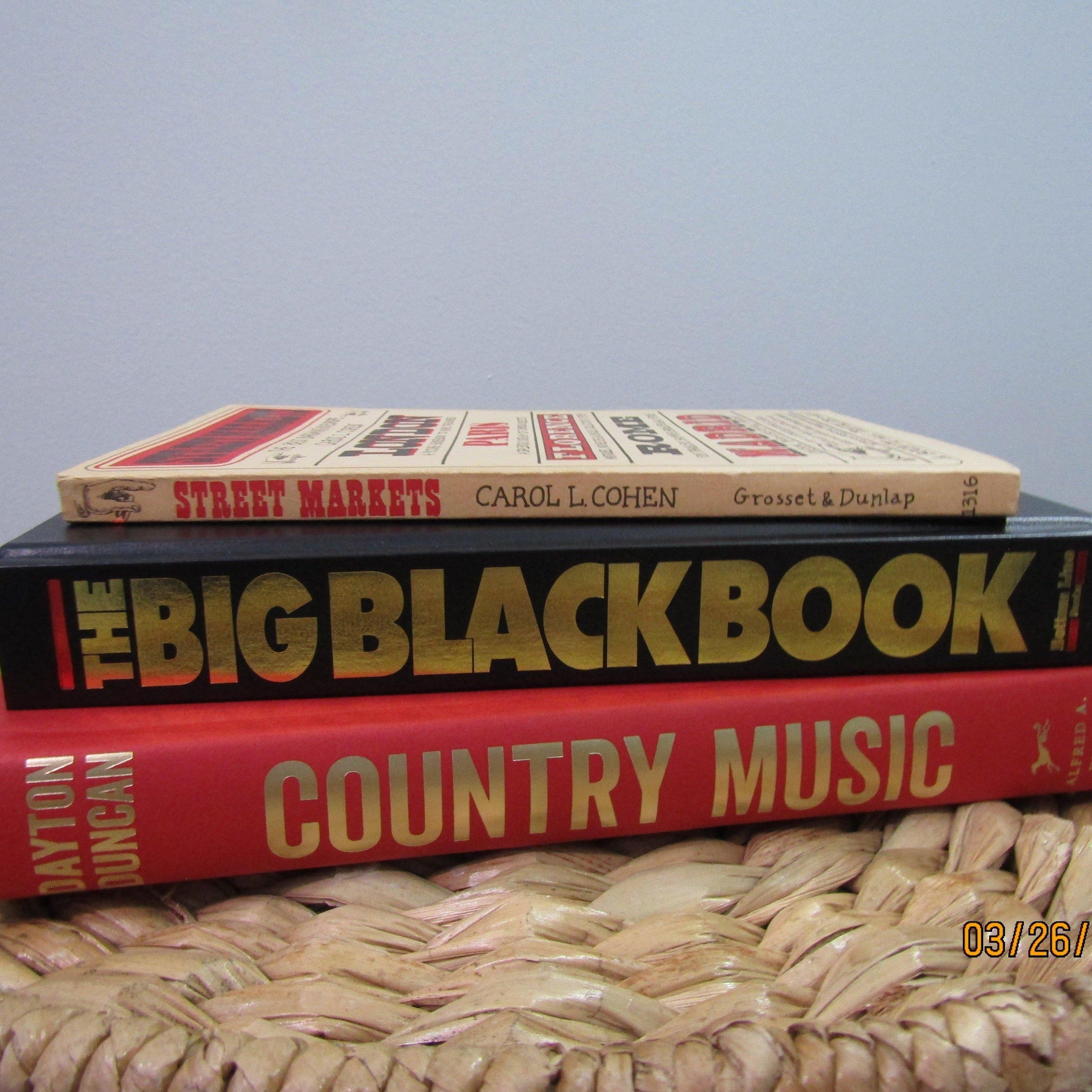 Stack of real books staged for display. Large and small books used for decorating. 
