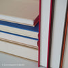 Books for display on shelf. Neutral and warm toned home decor. 