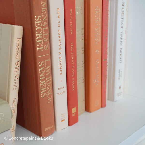 Books for display on shelf. Neutral and warm toned home decor. 