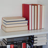 Books for display on shelf. Neutral and warm toned home decor. 