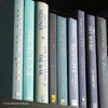 Real hardcover books in shades of blue for home decoration.